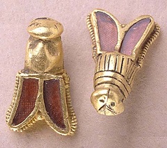 These beautiful gold and garnet bees represent the last remaining bees found in the grave of the Merovingian King Childeric, father of Clovis, the first king of the Franks.
